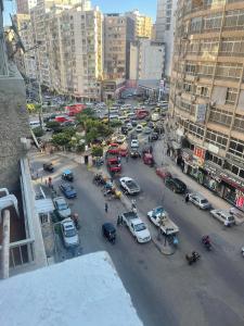 a busy city street with cars and people and buildings at sea zone in Alexandria