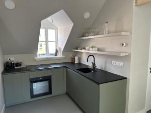 Kuchyň nebo kuchyňský kout v ubytování Luxe Loft in Historisch Pand in Walstraat Deventer