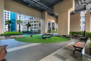 an empty lobby with a playground in a building at MIN' Apartment - Saigon Royal - Upscale Apartment - near Ben Thanh - Downtown in Ho Chi Minh City