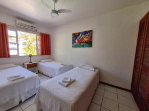 Cama ou camas em um quarto em Apart Hotel Beira do Mar