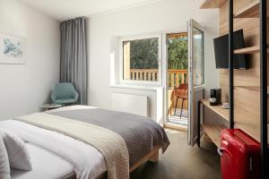 Postel nebo postele na pokoji v ubytování Ski & Spa hotel BELLEVUE