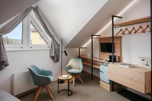 TV a/nebo společenská místnost v ubytování Ski & Spa hotel BELLEVUE