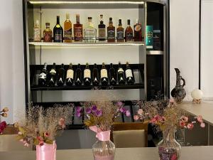 a shelf filled with bottles of wine on a table at Grand Central in Tsqaltubo