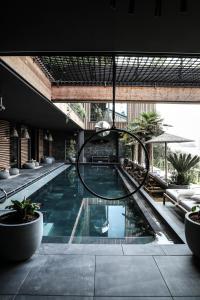 a swimming pool in a building with a building at Hotel Gerl in Salzburg