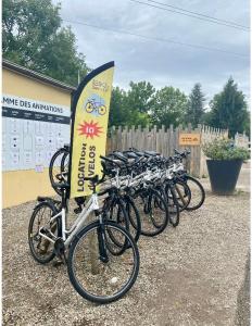 a row of bikes parked next to a sign at Mobile home proche de EUROPA PARK in Boofzheim