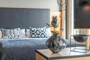 Posteľ alebo postele v izbe v ubytovaní hirschen dornbirn - das boutiquestyle hotel - skyrelax & wellness im rooftop