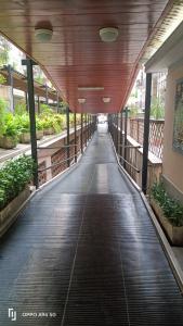 a walkway in a building with a wooden ceiling at Colombo Holidays APT in Rome