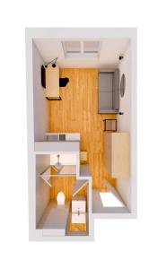 una cocina pequeña con paredes de madera en Schickes All-inklusive Apartmentzimmer by RESIDA Asset GmbH, en Brunn am Gebirge