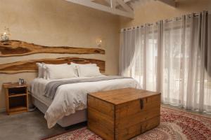 a bedroom with a bed and a large window at New Holme Nature Lodge in Hanover Road +271 photos
