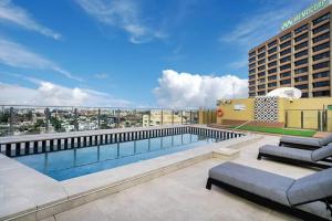 a swimming pool on the roof of a building at Studio in Hyde park, best location in Sydney City in Sydney