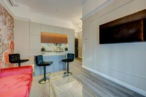 TV a/nebo společenská místnost v ubytování Allure NOVA Aparthotel