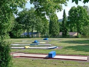 a bunch of surfboards are lined up on the grass at Traumhaftes Ferienhaus in Husen