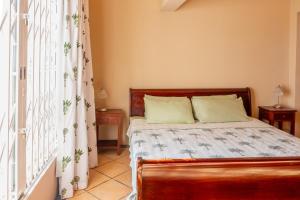 Voodi või voodid majutusasutuse Tamarin Seaside Apartment toas