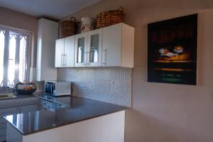 Köök või kööginurk majutusasutuses Tamarin Seaside Apartment