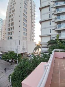 a view from the balcony of a building with tall buildings at Hotel Bahia Plaza in Santa Marta