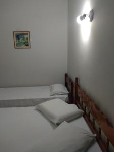 Tempat tidur dalam kamar di Pousada Samambaia SL