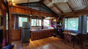 a kitchen with a refrigerator and a table in it at Marbella Beach (10min. walk) Nature Lovers & Surf in Marbella