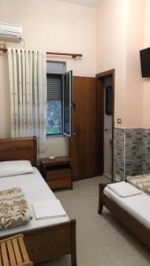 Postel nebo postele na pokoji v ubytování Guest House Kocollari + 29 fotografií