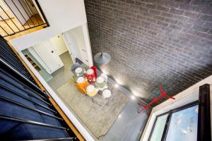 an overhead view of a living room with a table at Shoreditch 3-Storey Maisonette - by Living Elite Apartments in Shoreditch