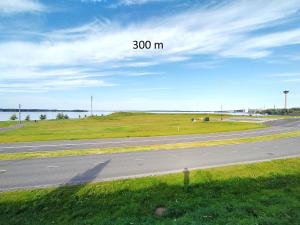 a road with a speed limit sign on the side of it at Fully Equipped New Apartment With Free Parking in Tampere