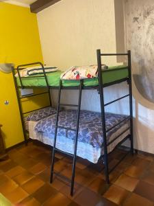 a couple of bunk beds in a room at B&B Happy Days Affittacamere in Sirmione