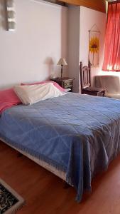 Una cama o camas en una habitación de Hosteria La Chacra
