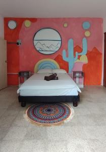 Säng eller sängar i ett rum på Garden House Puerto López