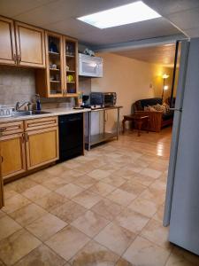 a kitchen with a sink and a dishwasher at University Heights Central 2 BRM in Athens