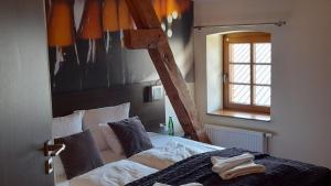 Posteľ alebo postele v izbe v ubytovaní Hotel Spichrz