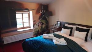 Posteľ alebo postele v izbe v ubytovaní Hotel Spichrz