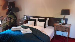 Posteľ alebo postele v izbe v ubytovaní Hotel Spichrz