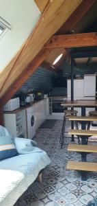 a kitchen with a bed and a table in a room at le perchoir a 500m des plages in Cancale