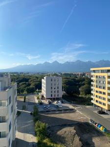 an aerial view of a city with mountains in the background at Mountain View Apartment in Poprad