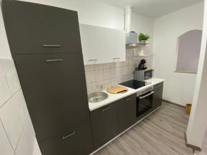 a kitchen with a sink and a counter top at R&A in Elsdorf