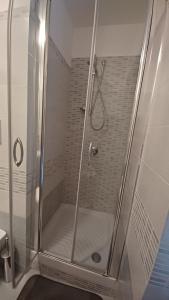 a shower with a glass door in a bathroom at Appartamento B&B La Meta in Fisciano +32 photos