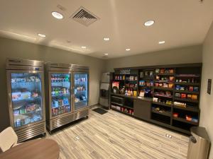 a store with two refrigerators and shelves of food at Candlewood Suites - Lebanon, an IHG Hotel in Lebanon