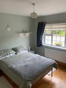 En eller flere senger på et rom på Garrenmore Lodge B&B
