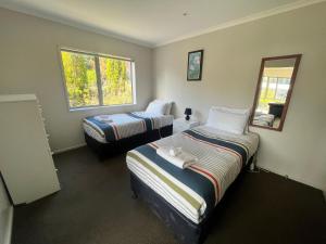 Un pat sau paturi într-o cameră la Glenrydge