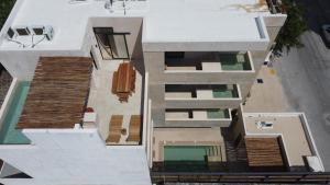 an aerial view of a house with a swimming pool at Akbal Tulum in Tulum