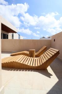 a wooden boat sitting on the side of a building at Akbal Tulum in Tulum