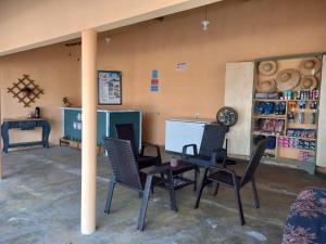 Гостиная зона в Pousada raio de sol