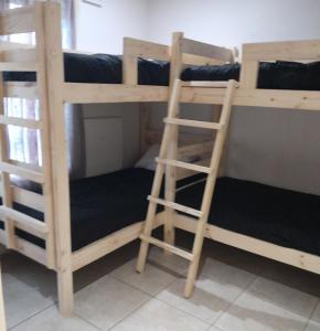 a couple of bunk beds in a room at Secunda BackPackers in Secunda