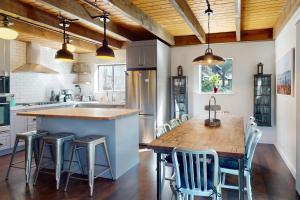 a kitchen with a large wooden table and chairs at Tahoe Tyrol Chalet in South Lake Tahoe