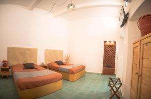 Postel nebo postele na pokoji v ubytování Casa Sofi Oaxaca