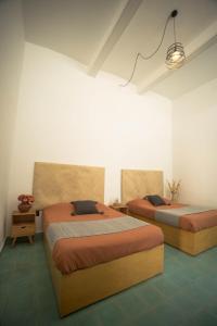 Postel nebo postele na pokoji v ubytování Casa Sofi Oaxaca