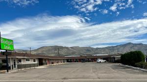 an empty parking lot in front of a motel at Budget Inn in Alamogordo +27 photos