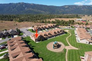 an aerial view of a village with a red arrow pointing to a building at Near Tamarack AC Kitchen TV Washer Dryer in Donnelly