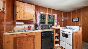 a kitchen with a sink and a stove at The Don Hoel Resort & Venue in Sedona