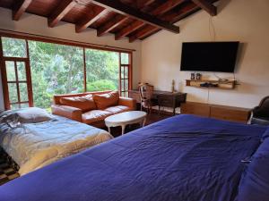 Un paraíso en la montaña Bogotá Verjon Via La Calera tesisinde bir odada yatak veya yataklar