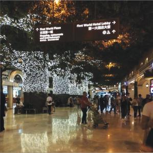 a crowd of people walking in a mall with lights at Room in Genting Highland in Genting Highlands